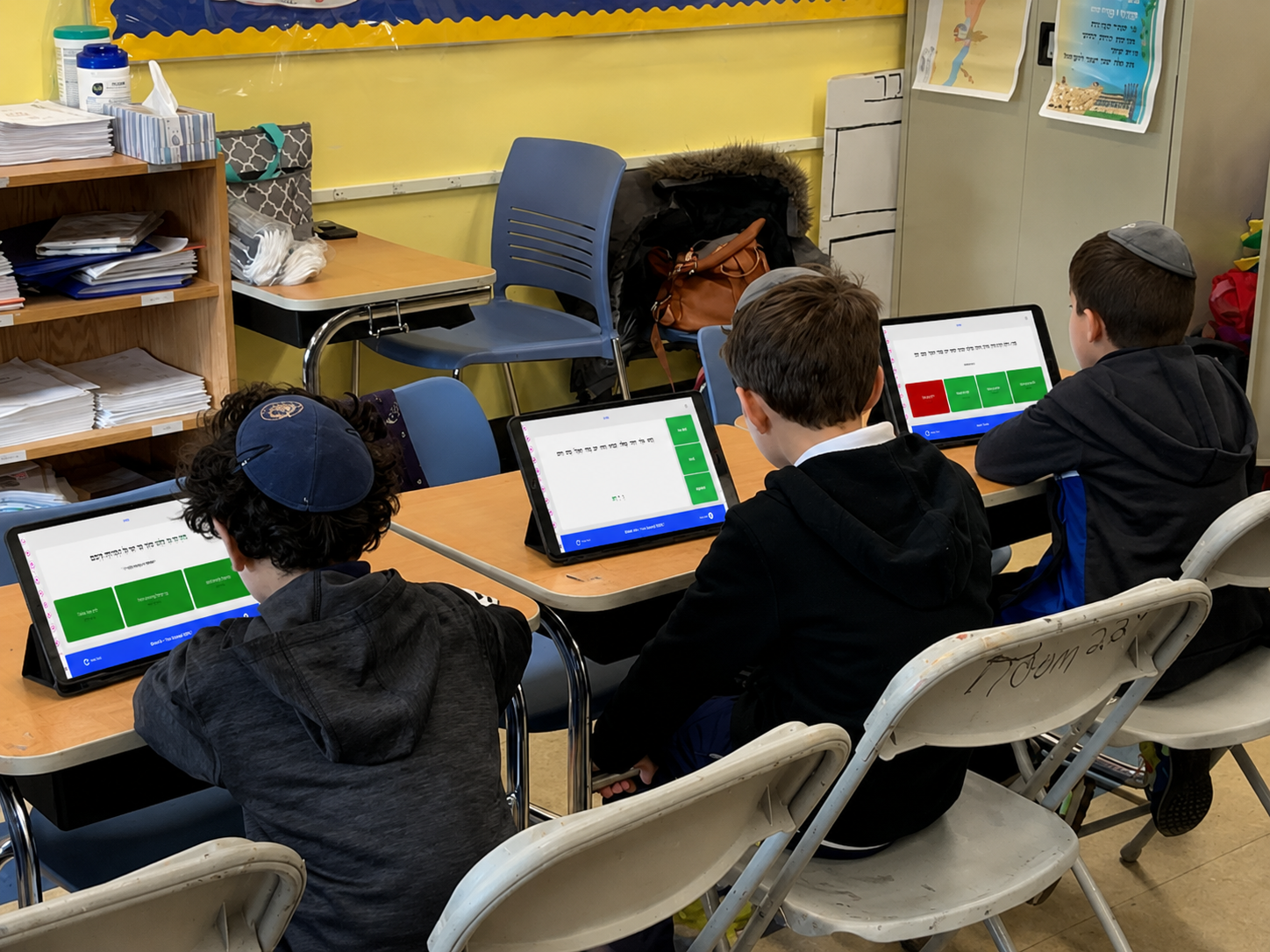 Students using MasterED on tablets
